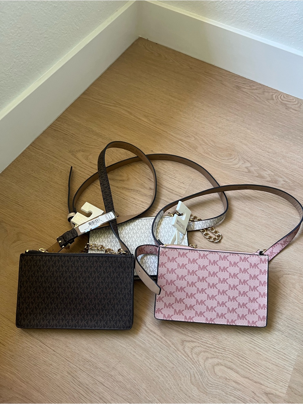 Michael Kors Mk Signature Crossbody Trio In Pink, Brown, And Ivory